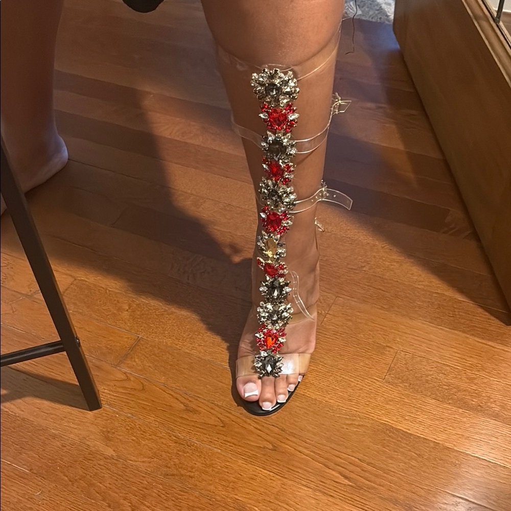 Elegant Clear Gladiator Sandals with Red and Gold Accents